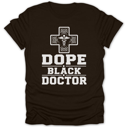 Brown t-shirt with white text "Dope Black Doctor" and a caduceus cross.