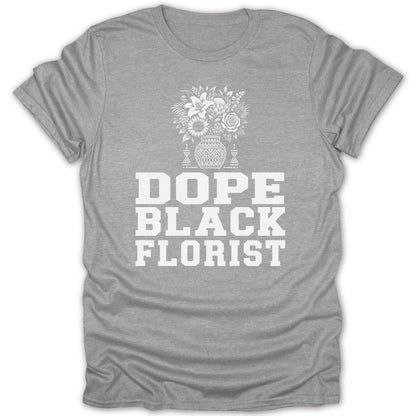 Grey t-shirt with white text and floral graphic reading "DOPE BLACK FLORIST".