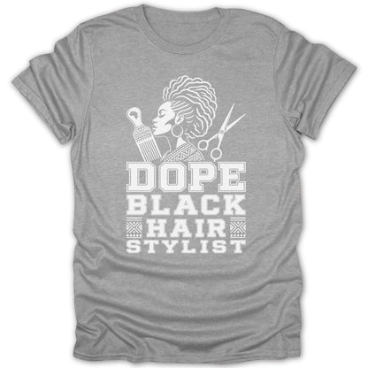 Grey t-shirt with white text and graphic of a woman, comb, and scissors.