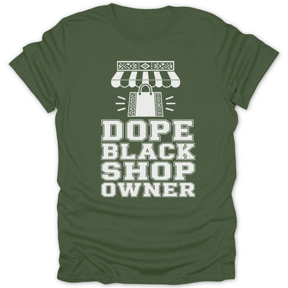Green t-shirt with white text and graphic of a shop awning and shopping bag.