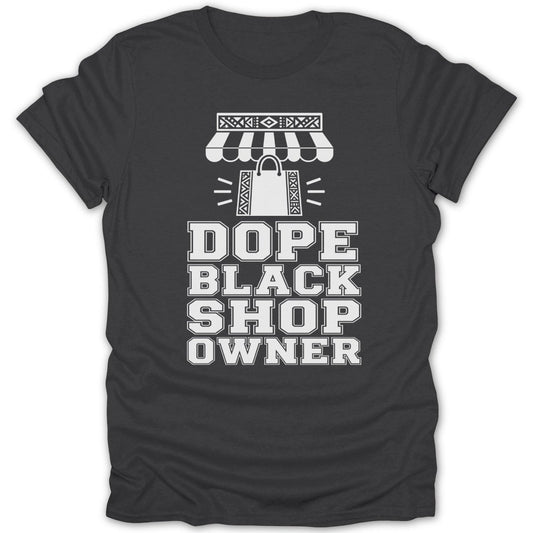 Dark gray t-shirt with white text and graphics that read "DOPE BLACK SHOP OWNER".