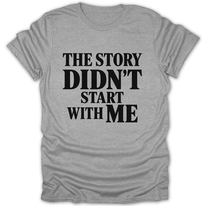 Heather gray t-shirt featuring the black text THE STORY DIDN'T START WITH ME.