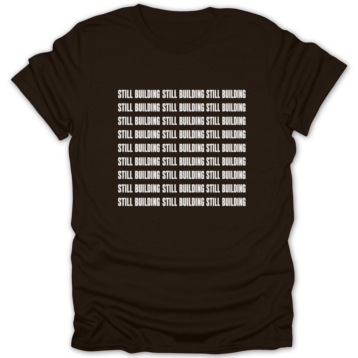 Brown t-shirt with repeated white text "STILL BUILDING" across the chest.