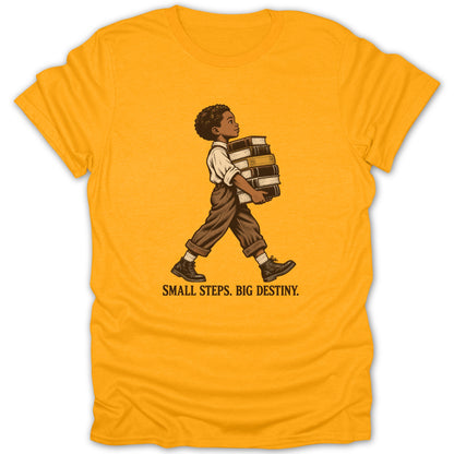 Illustration of boy carrying books on a yellow t-shirt with text "Small Steps. Big Destiny."