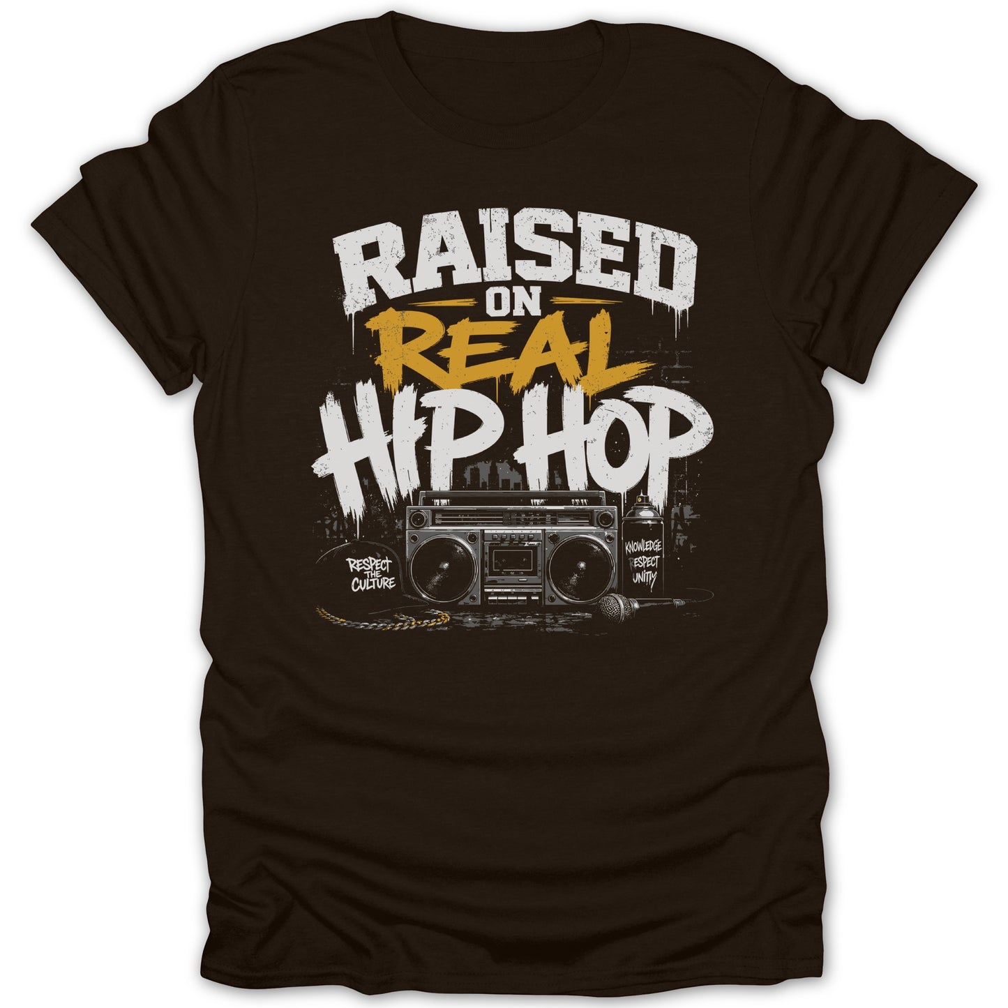 Raised on Real Hip Hop graphic with boombox and microphone on a brown t-shirt.