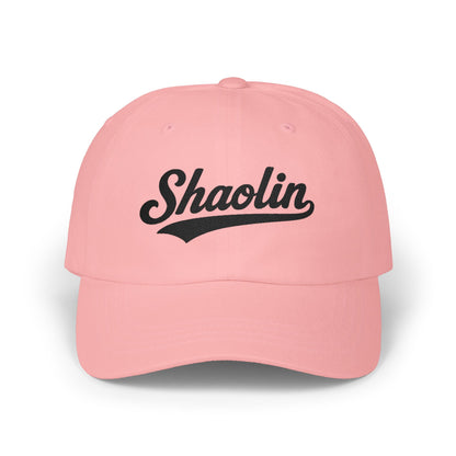 Pink baseball cap with "Shaolin" in black script text.