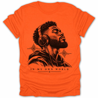 Black and white illustration of man with headphones on an orange t-shirt, text reads "IN MY OWN WORLD".