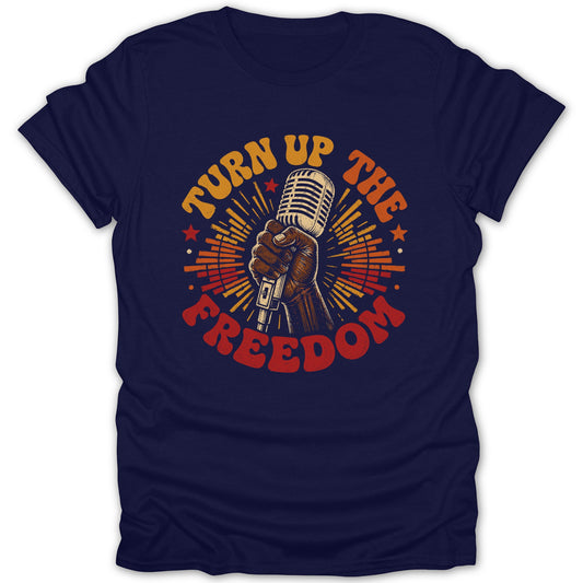 Navy t-shirt with a vintage microphone held by a hand and text "TURN UP THE FREEDOM."