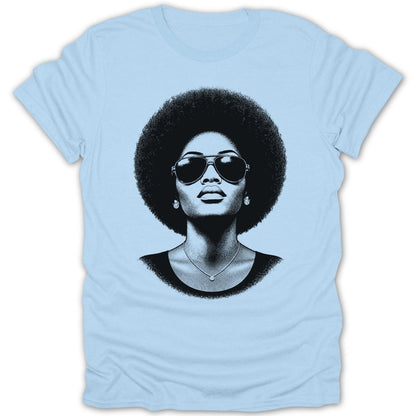 Illustration of a woman with an afro, sunglasses, and a necklace on a light blue t-shirt.