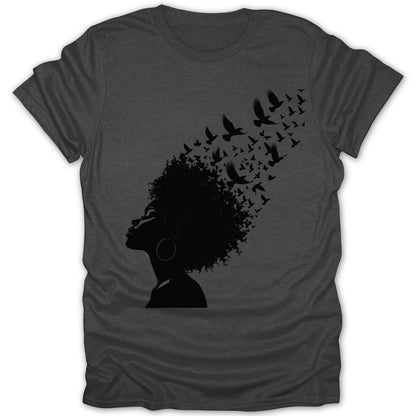 Silhouette of a woman's profile with birds flying from her hair.