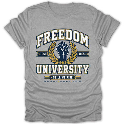 Grey t-shirt with "FREEDOM UNIVERSITY STILL WE RISE" and a fist logo.