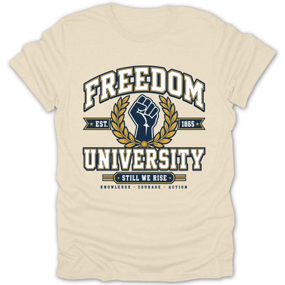 Cream t-shirt with Freedom University crest, fist, and "Still We Rise".