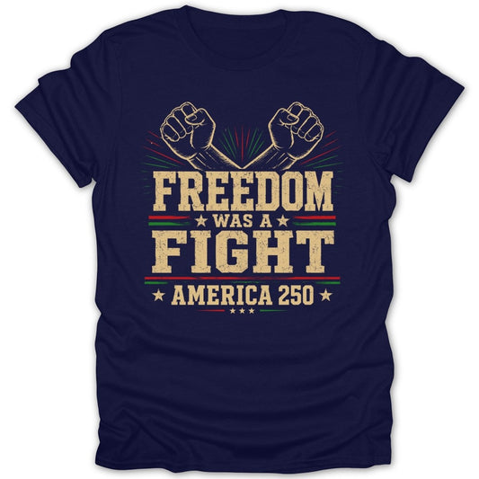 Navy t-shirt with text "FREEDOM WAS A FIGHT AMERICA 250" and crossed fists.