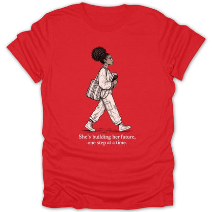 Red t-shirt with black ink illustration of a woman holding books and a bag, with text.