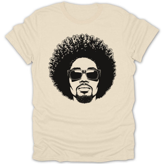 Black and white graphic of a person with an afro and sunglasses on a cream t-shirt.