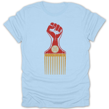 Red fist on a hair pick with a circular symbol against a light blue t-shirt.