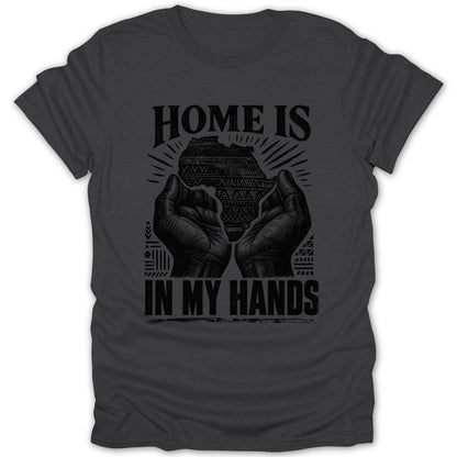 Dark grey t-shirt with black graphic: "HOME IS IN MY HANDS" above map of Africa.