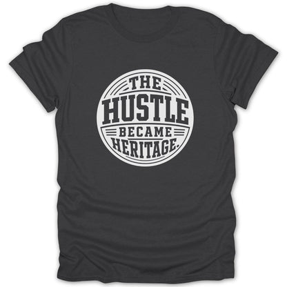 Dark grey t-shirt with white text: THE HUSTLE BECAME HERITAGE.
