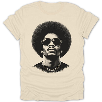 Black and white graphic of a man with an afro, sunglasses, and chain on a cream t-shirt.