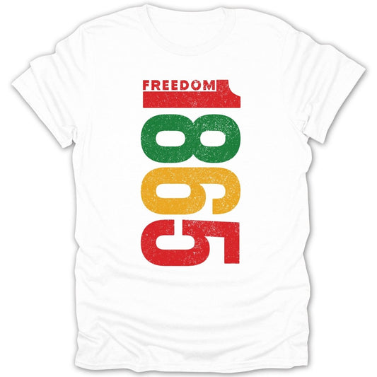 White t-shirt with "FREEDOM" and "1865" in red, green, and gold blocks.