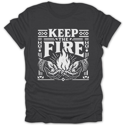 White graphic on dark t-shirt reads "KEEP THE FIRE" above cupped hands holding a flame.