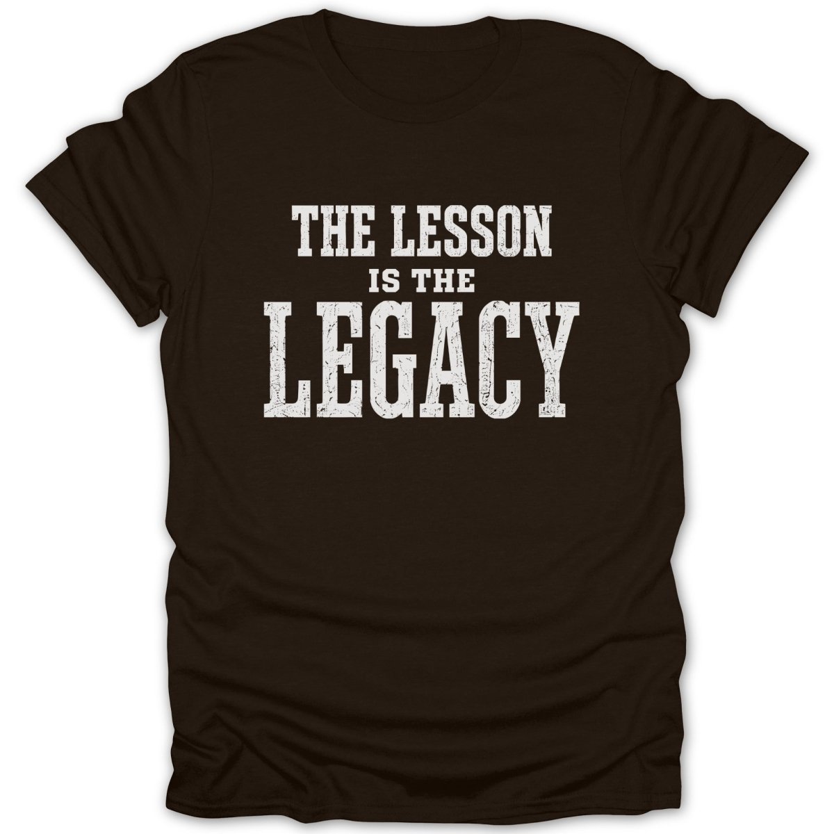 Brown t-shirt with white text reading "THE LESSON IS THE LEGACY".