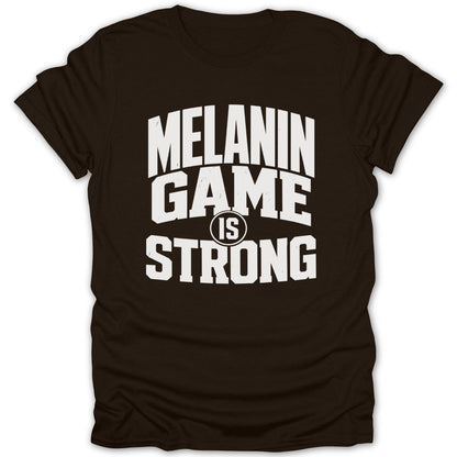 Brown t-shirt with white text reading "MELANIN GAME IS STRONG"