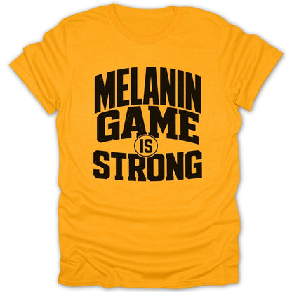 Yellow t-shirt with black text "MELANIN GAME IS STRONG".