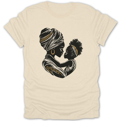 Black and gold graphic of mother and child embracing on a cream t-shirt.