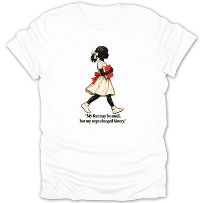 White t-shirt with graphic of a young Black girl holding a red book; text reads "My feet may be small, but my steps changed history."