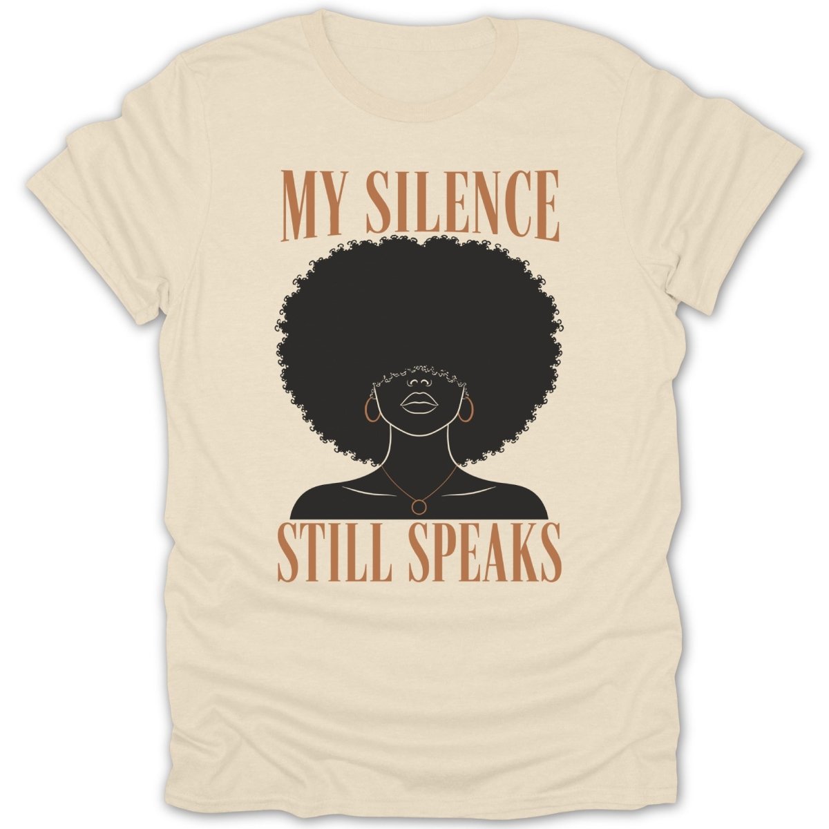 Cream t-shirt with text "MY SILENCE STILL SPEAKS" and a silhouette of a Black woman.