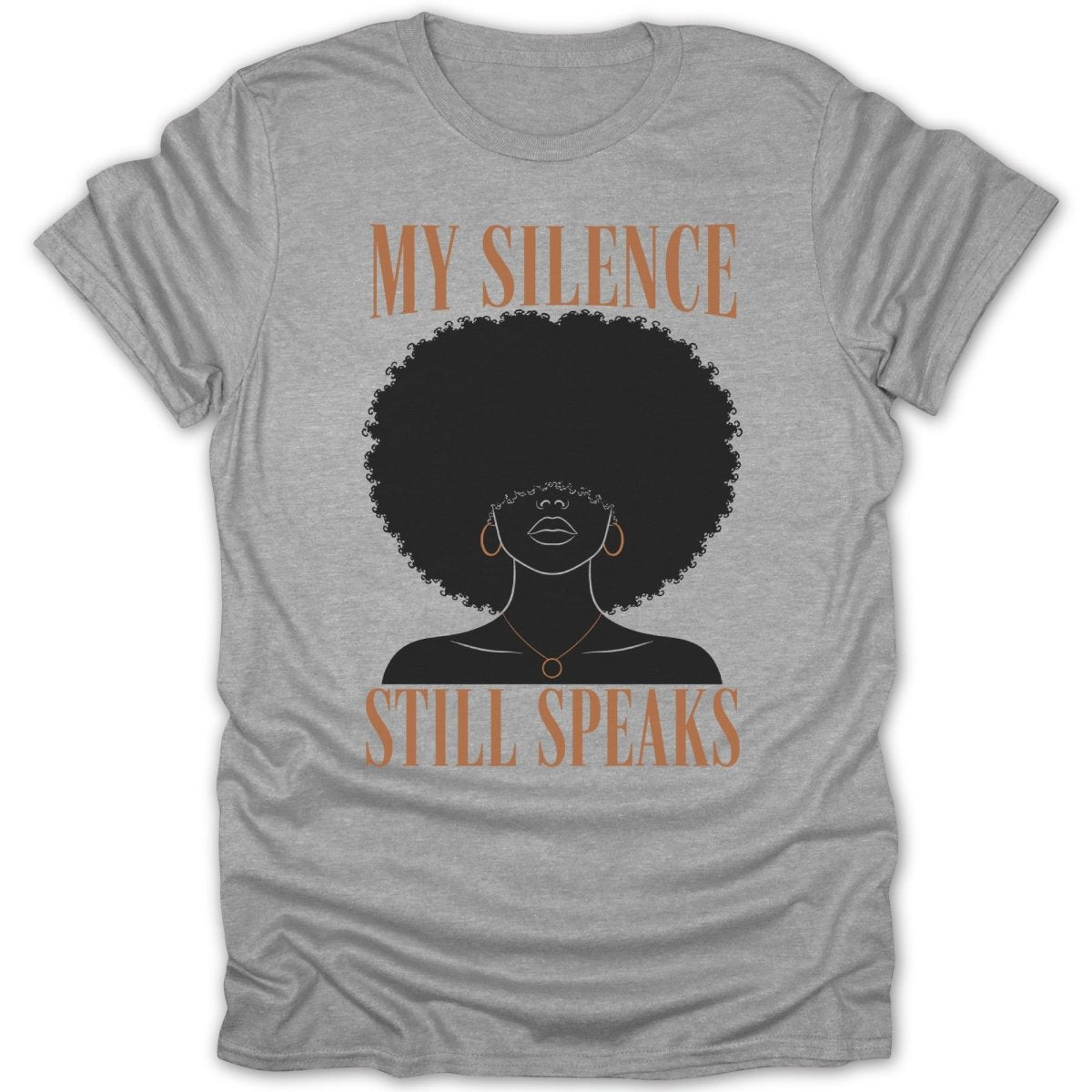 Grey t-shirt with a silhouette of a woman with an afro, reading "My Silence Still Speaks."