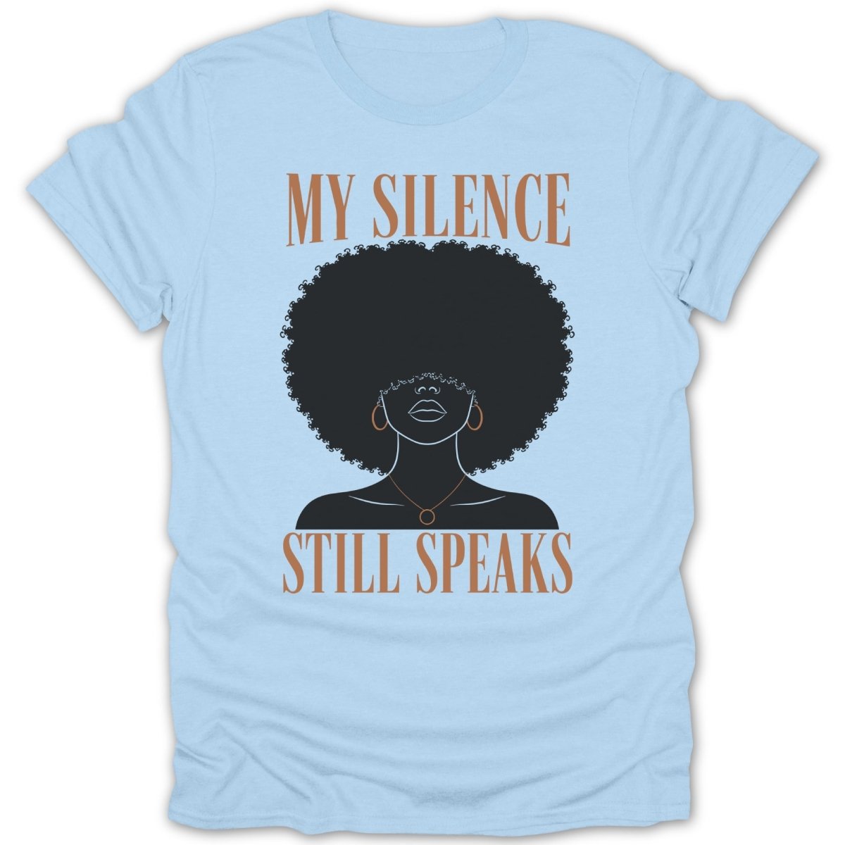 Light blue t-shirt with black silhouette of woman with afro, text says "MY SILENCE STILL SPEAKS".