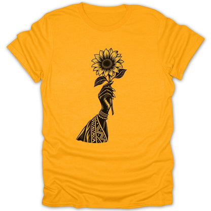 Black illustration of a hand holding a sunflower on a yellow t-shirt.