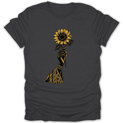 Black t-shirt with gold graphic of a hand holding a sunflower.