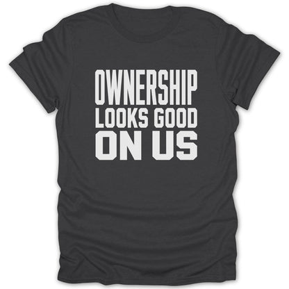 Dark gray t-shirt with white text saying "OWNERSHIP LOOKS GOOD ON US".