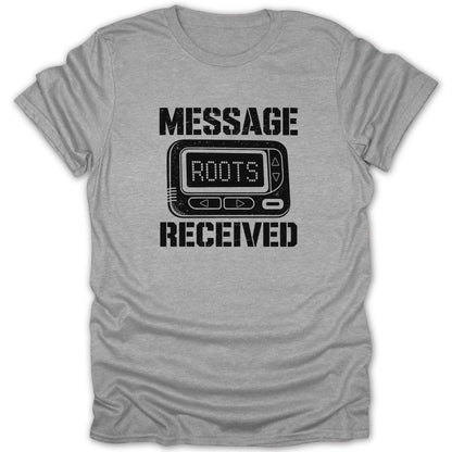 Grey t-shirt with distressed black text and graphics of a pager reading "ROOTS" and "MESSAGE RECEIVED".