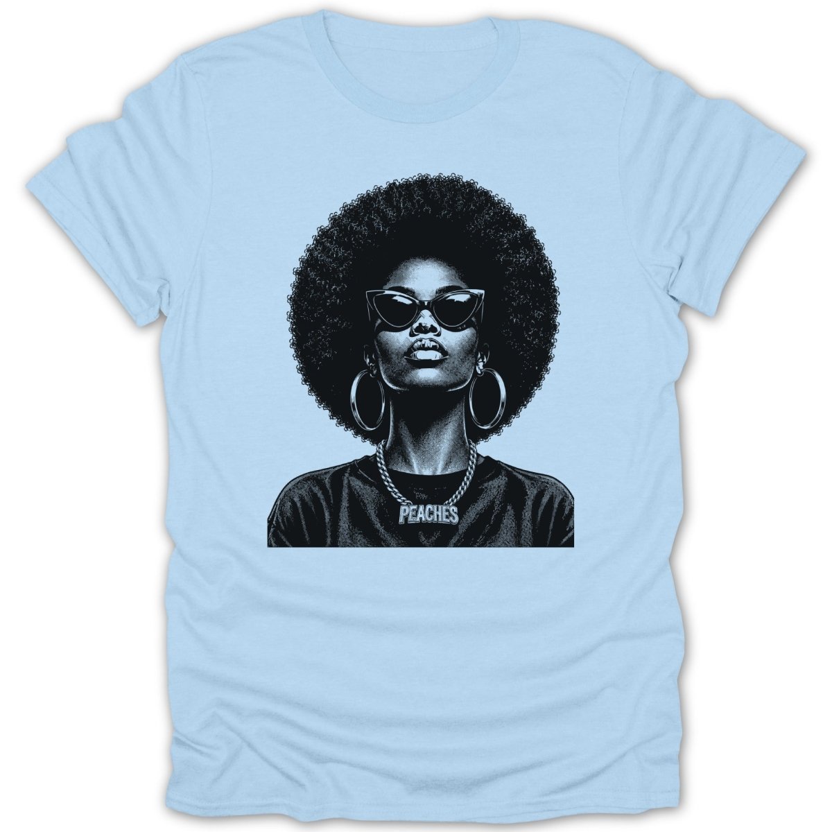 Faded black graphic of a woman with large afro, sunglasses, and "PEACHES" necklace on light blue t-shirt.