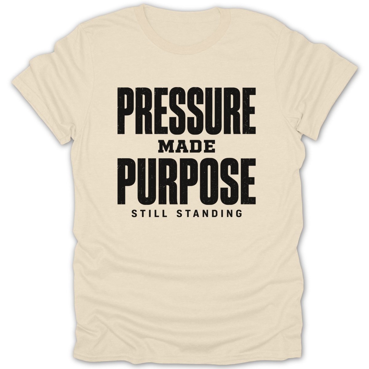 Cream t-shirt with black text "PRESSURE MADE PURPOSE STILL STANDING".