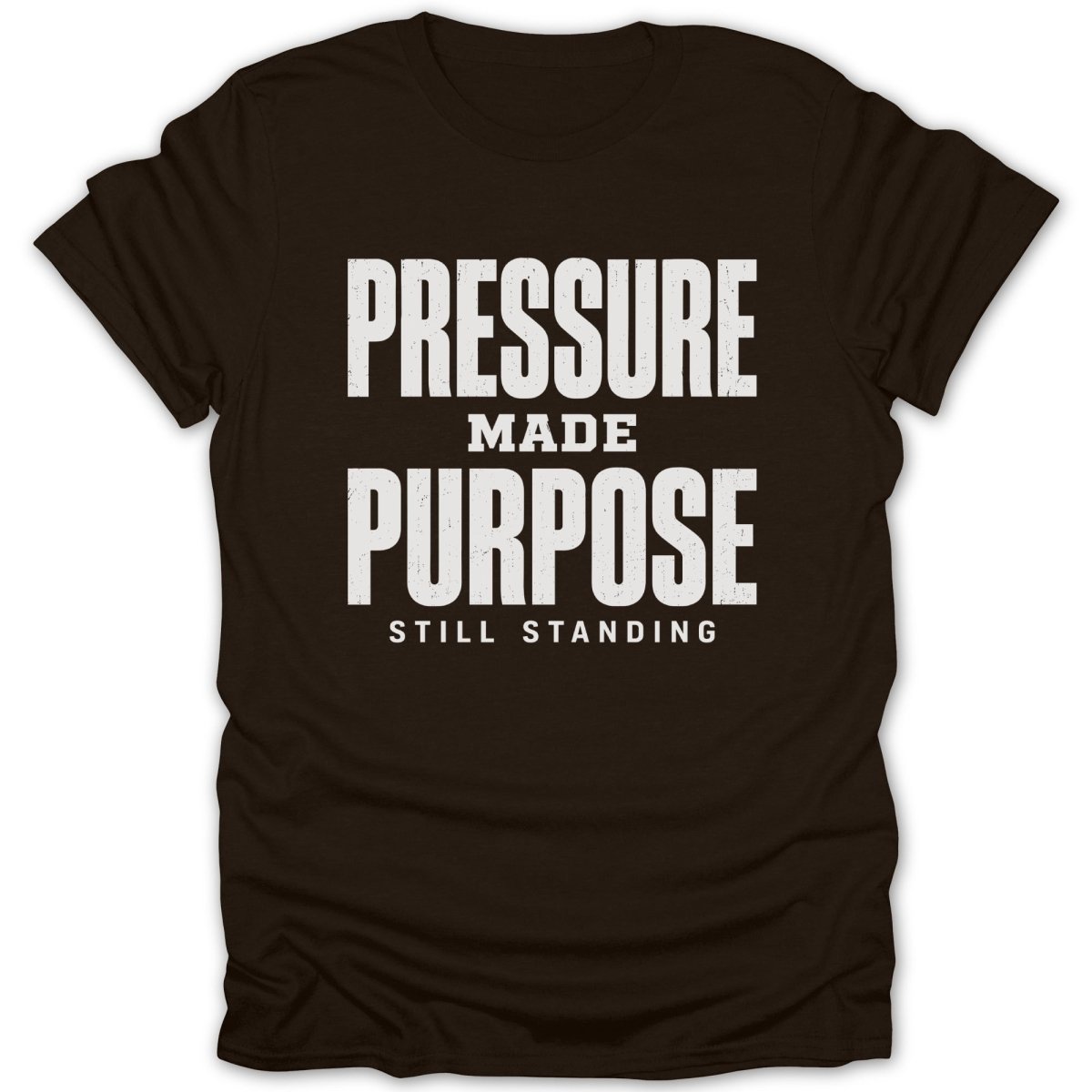 Brown t-shirt with white text "PRESSURE MADE PURPOSE STILL STANDING".