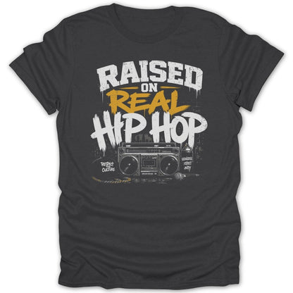 Dark gray t-shirt with "Raised on Real Hip Hop" graphics, boombox, and graffiti.