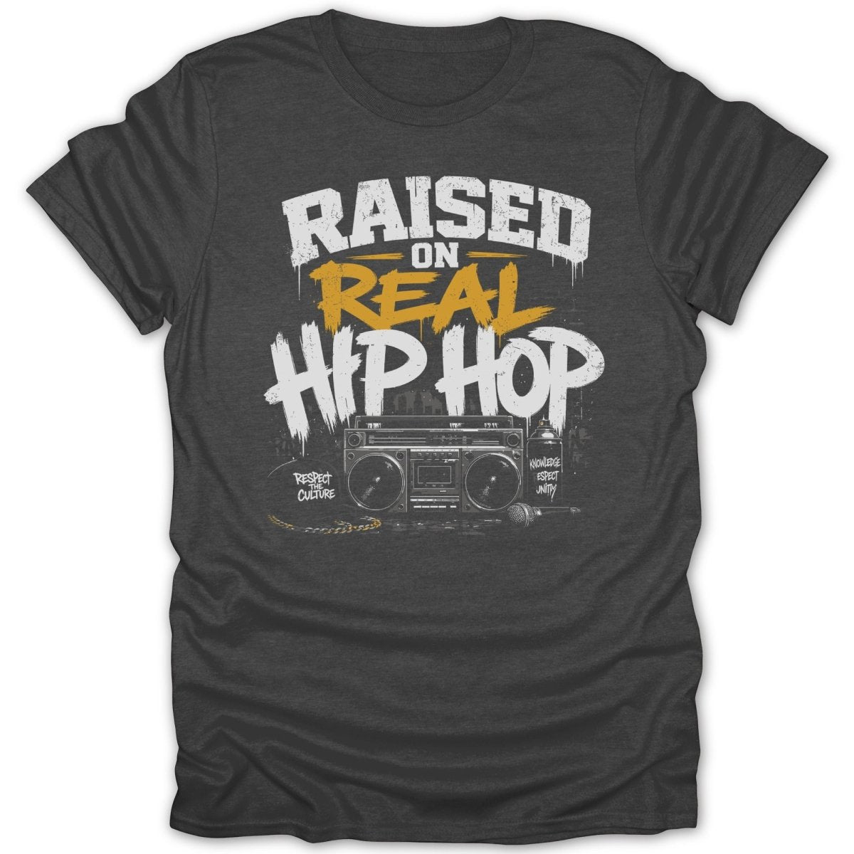 Dark t-shirt with "Raised on Real Hip Hop" graphic featuring boombox, microphone, and spray paint.