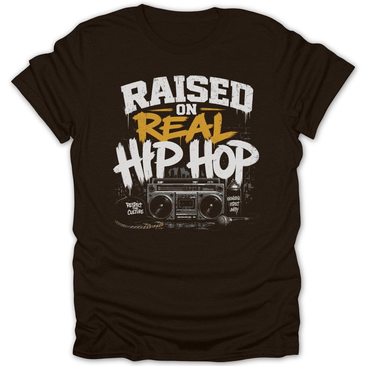 Raised on Real Hip Hop graphic with boombox and microphone on a brown t-shirt.
