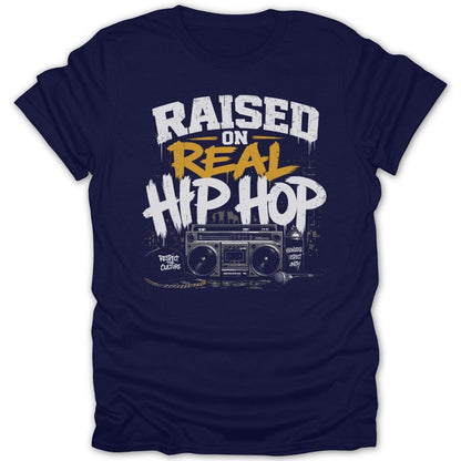 Navy t-shirt with "Raised on Real Hip Hop" text and boombox graphic.