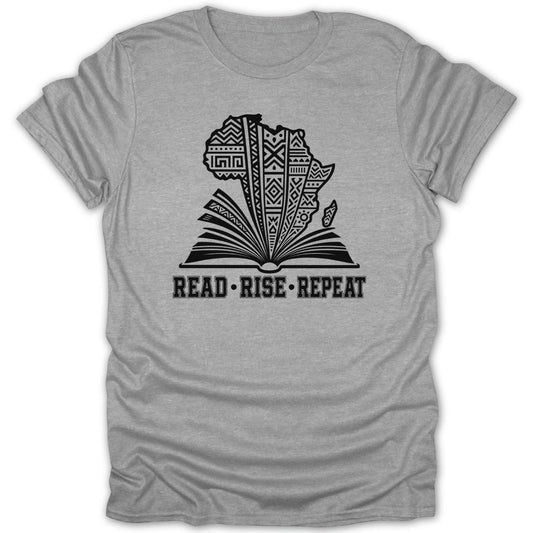 Gray t-shirt with black graphic of Africa on an open book. Text reads: READ • RISE • REPEAT.