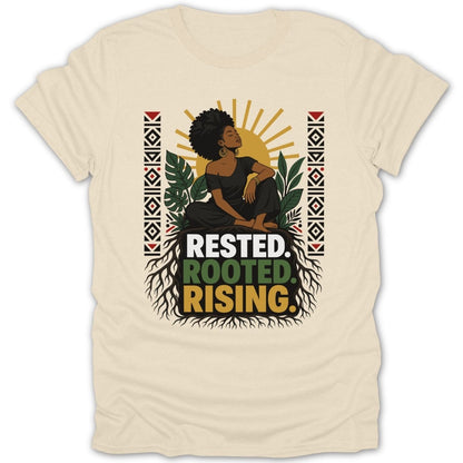 Cream t-shirt with black woman seated above text "RESTED. ROOTED. RISING."