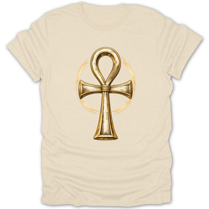 Gold ankh symbol with golden circle on a cream t-shirt.