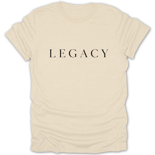 Cream t-shirt with the word LEGACY printed in black serif font.