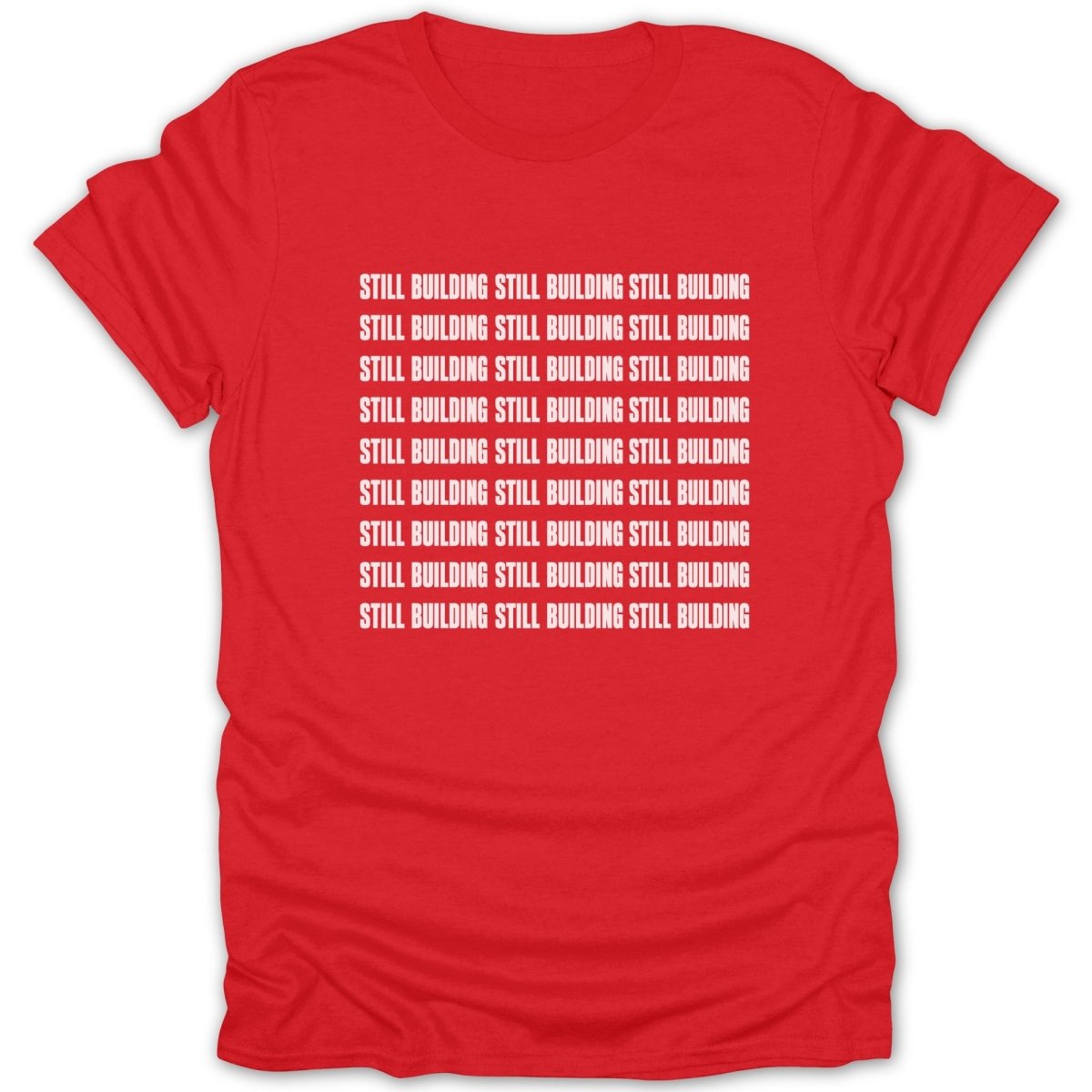 Red t-shirt with white text "STILL BUILDING" repeated in multiple lines.