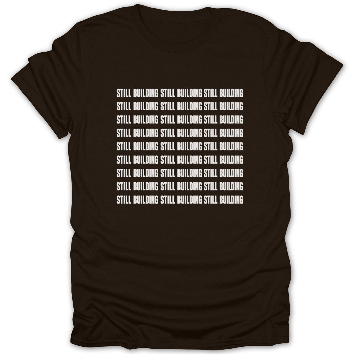 Brown t-shirt with repeated white text "STILL BUILDING" across the chest.